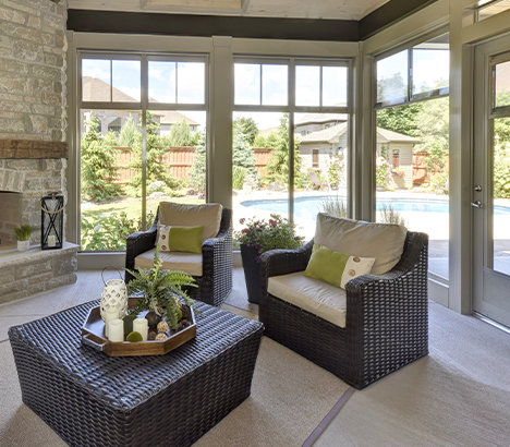 Beautiful interior of a large bright sunroom with large windows